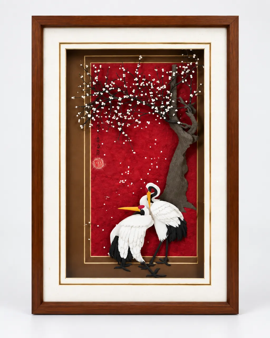 梅影雙鶴立體紙雕完整正面圖,呈現白梅、雙鶴、紅色背景與木框